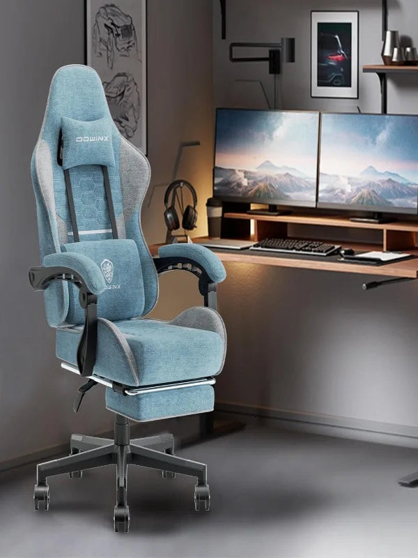 Blue office chair in a modern office setting with two monitors on a desk.